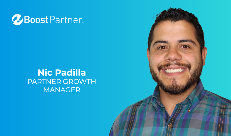 Professional portrait of a smiling man in a plaid shirt on a blue gradient background with company branding